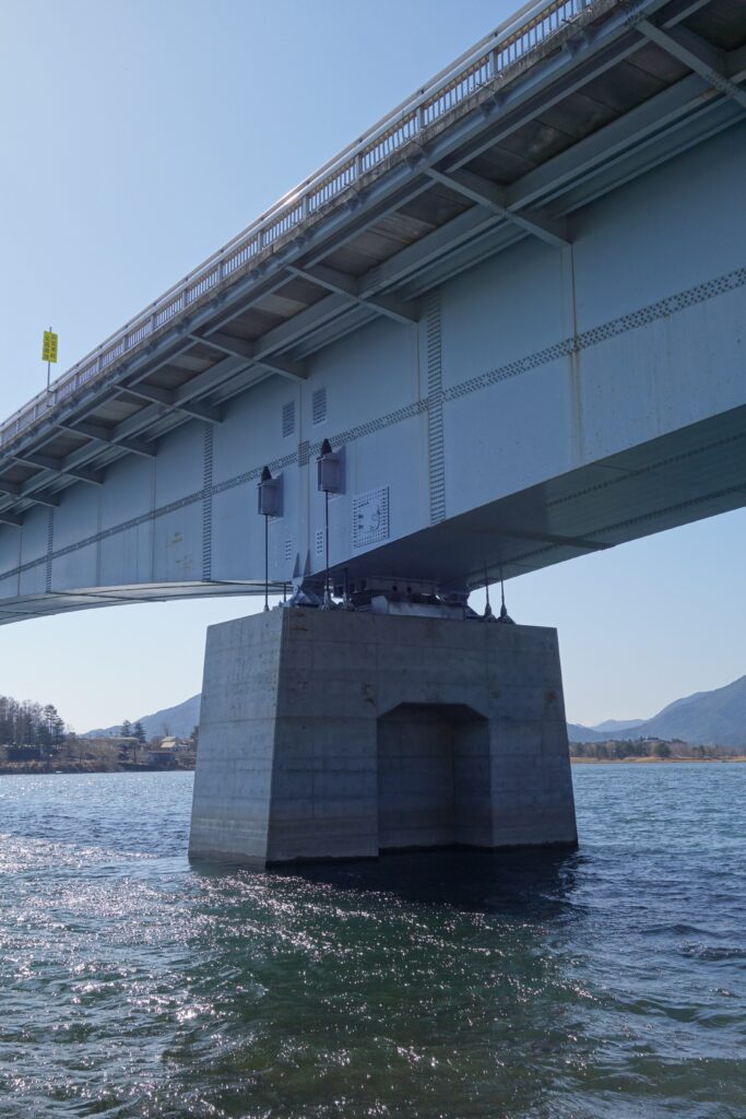 A superficial example of this is the chains on bridges and raised freeways to prevent collapse in an earthquake.