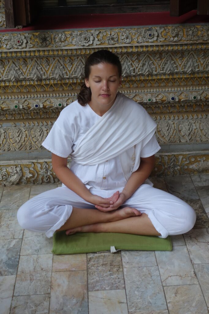 Amy demonstrating sitting meditation.