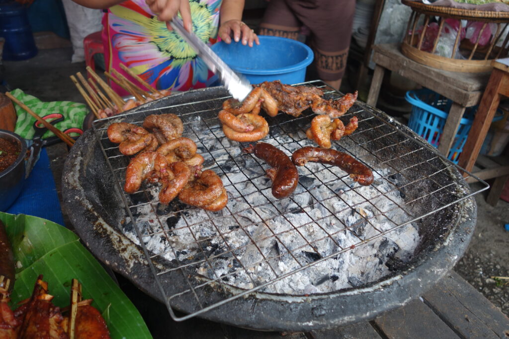 Meat for sale at the Morning Market in Luang Prabang. These buffalo sausages (in the foreground) were very heavily spiced with lemongrass and chilies and were the most delicious sausages we have ever had!