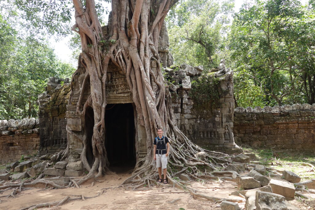 Jon in front of one of the temples covered with a strangler fig.