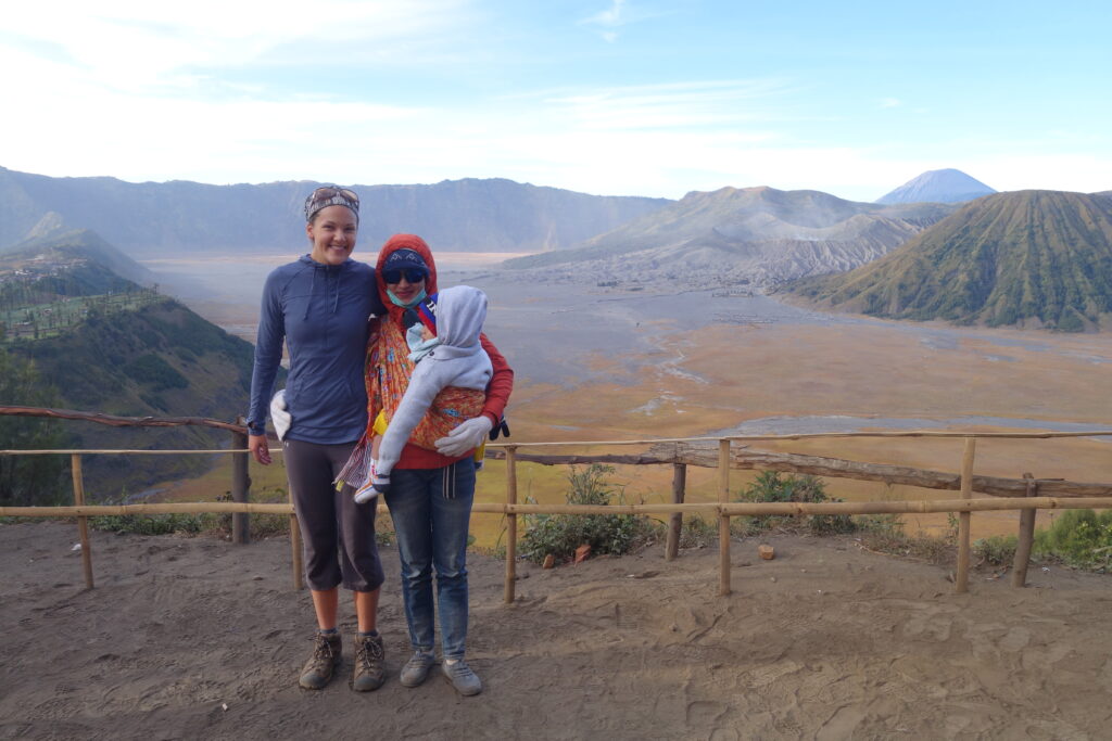 A woman poses with me at the Bromo lookout point. Notice her batik cloth baby carrier! Side note: she asked to take a photo with me --because of my white skin.